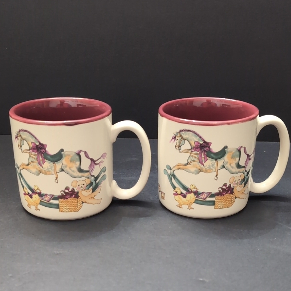 1987 Potpourri Press Set Of 2 Ceramic Rocking Horse/Toys Design Coffee Mug.